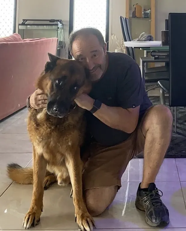 Ben, the founder of At Home Petcare, with his German Shepherd Dexter